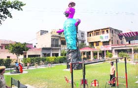 An effigy of Ravana erected right under high-tension wires at Juneja Park on Ladowali Road in Jalandhar on Thursday