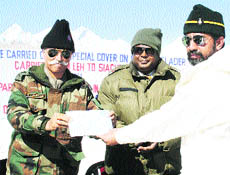 Lt Gen KT Parnaik, General Officer Commanding-in-Chief, Northern Command, and John Samuel, Chief Post Master General, J&K circle, release a special cover at a function organised at the Siachen Glacier.
