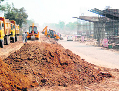 A view of the ongoing work on the eight- laning of the Jalandhar- Amritsar road.