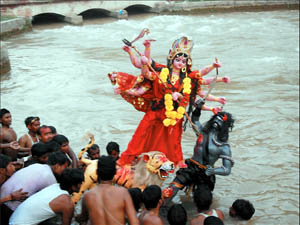 Devotees immerse the idol of Goddess Durga in the Sirhind canal on Friday on Bathinda. 