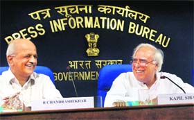 Minister for Communications & Technology Kapil Sibal (R) with telecom secretary R Chandrashekhar addressing a press conference to announce the draft national policy on ICT, 2011 in New Delhi on Friday