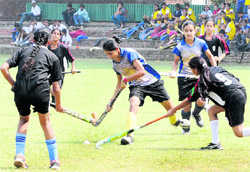 Players vie for the ball during a hockey match at the Sector-18 stadium in Chandigarh on Friday