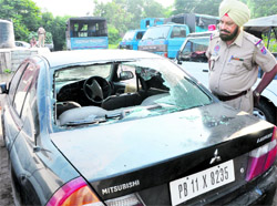 The shattered windscreen of a car belonging to one of the victims after they were fired upon outside a private hospital in Mohali on Friday morning