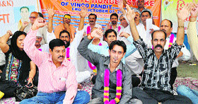Members of the All Parties Migrants Coordination Committee hold an indefinite fast in Jammu on Friday.
