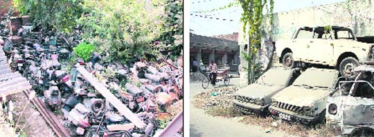 Impounded vehicles lie dumped at the old complex of the Division No 8 police station (left) and at Division No 7 police station (right) in Jalandhar.