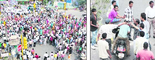 Safai karamcharis of the MC block traffic at Company Bagh as they burn an effigy of in charge of the Punjab BJP Navjot Sidhu; and (right) they try to stop a scooter rider at the blockade in Jalandhar on Friday. 