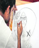 A boy participates in a cartoon-making competition at the youth fest at GADVASU in Ludhiana on Friday. 