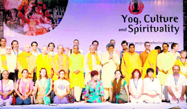 Foreign yoga experts with head of the All-India Gayatri Family Shail Jiji and Chancellor of Dev Sanskrit University Pranav Pandya at the concluding session of the International Yoga Festival in Haridwar on Saturday