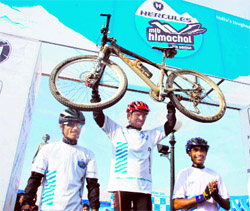 Runner-up Nayan Narayanan, winner Ajay Chettri and 2nd runner-up Vijay Kumar of the Hercules MTB Himachal 2011 rally at the Ridge in Shimla on Saturday