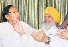 A leader of the Safai Karamchari Sangharsh Morcha argues with Cabinet Minister Hira Singh Gabria at the Circuit House in Ludhiana on Saturday. 