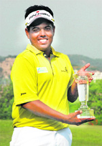 Sri Lankas Mithun Perera holds the Haryana Open trophy at the PGC on Saturday.