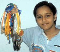 Judo champion Suxam Singla displays over 50 medals that she has won in various events