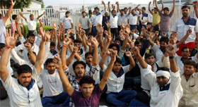 Workers of the Suzuki motorcycle plant hold a demonstration at Kherki Daula in Gurgaon.