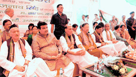 BJP chief along with senior party leaders, including Rajnath Singh and Uttarakhand Chief Minister BC Khanduri, at a party workers convention at Parade Ground in Dehradun on Sunday.
