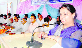 Nupur Gupta, leader of the BSP, addresses a gathering to mark the death anniversary of Kanshi Ram in Dehradun on Sunday.