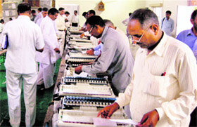 Assistant Returning Officers engaged in inspecting electronic voting machines during an Assembly constituency-wise rehearsal at Hisar on Sunday.