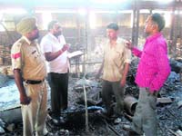 Policemen examine the furnace blast spot at the factory in Ludhiana on Sunday.