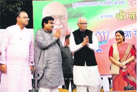 BJP leader LK Advani, party chief Nitin Gadkari and Arun Jaitley at the song release in New Delhi on Sunday