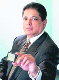 Indian-American Raj Dutt shows the computer chip he has developed, in Washington