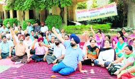 Teachers stage a dharna on GND varsity campus on Monday