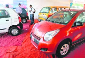 A "car carnival" in Mumbai on Monday. Leading industry body SIAM sharply lowered its car sales growth forecast for the current fiscal as high interest rates and rising prices keep buyers out of the showrooms