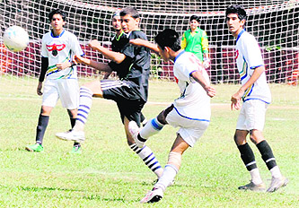 Players in action during a football match at the Mini Olympics in Chandigarh on Monday.