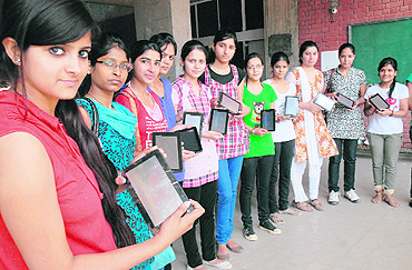 Sonali Garg (extreme right) and Manmeet Kaur (2nd from right) are the first two students in the country to have got the tablet PC, Aakash, along with 18 other city girls.