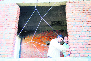 The officials of the MDDA seal an illegal construction in Doodhli village near Mussoorie.