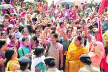 Anganwari workers hold a demonstration in front of the Secretariat in Dehradun on Monday.