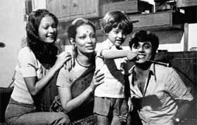 With their children in happier times. Monica, Chitra's daughter (sitting behind Chitra) committed suicide in 2009.