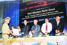 J. Gahlaut, a former secretary of the Red Cross Society, Rohtak and Faridabad, receives the National Award of St. John Ambulance Brigade from Union Health Minister Ghulam Nabi Azad in New Delhi.