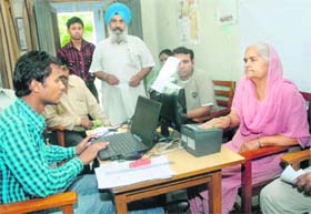 Work of registering UID cards in progress at Khalsa College, Nakodar Chowk, Jalandhar