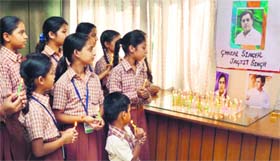 Students of St Soilder School light up candles as they pay tributes to Jagjit Singh in Jalandhar on Monday