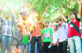 The National Panthers Students Union hold a protest against Chief Minister Omar Abdullah outside GGM Science College in Jammu on Monday. 