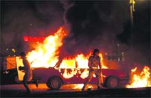 A vehicle on fire at the site of clashes between soldiers and protesters in Cairo.