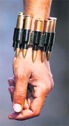 An anti-Gaddafi fighter wears a bracelet made with bullets in Sirte.