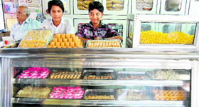 Shopkeepers wait for customers at a sweetshop in Amritsar.