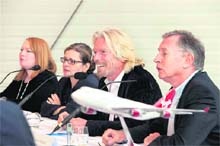 Jennifer Holmgren (2nd from left), CEO of energy firm LanzaTech, Virgin Atlantic president Richard Branson and airline CEO Steve Ridgway at a press conference to announce a partnership to produce low carbon aviation fuel made out of waste gases in India in London on Tuesday.
