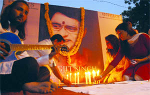 Fans of ghazal maestro, the late Jagjit Singh, light candles to pay tributes to him at Jantar Mantar in New Delhi on Tuesday. 