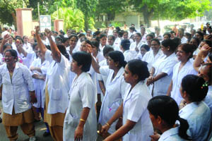Nurses of Lady Hardinge Hospital shout slogans during a protest against the MS outside the hospital in New Delhi on Tuesday. 