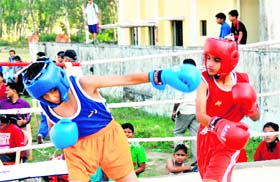 A bout under way in the District-level Boxing Championship in Dehradun on Tuesday