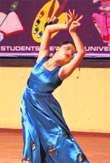 A girl performs during a dance competition at the University of Jammu on Tuesday.