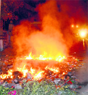 A heap of garbage set on fire along roadside causes inconvenience to passersby in Jalandhar.