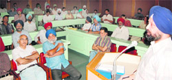 Faculty members of the GND Varsity during a general house meeting of GND University Teachers Association on the varsity campus in Amritsar on Wednesday