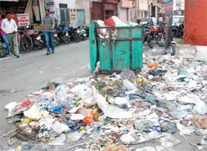 A view of the overflowing garbage dump near the Dhobi Bazaar. Cleanliness drive in the city has taken a backseat of late. 