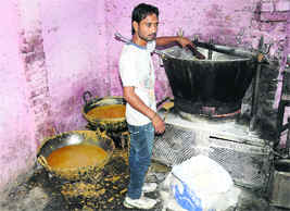 Sweets being prepared in unhygienic conditions in a room at Bapu Dham Colony, Sector 26, Chandigarh, on Wednesday.