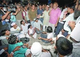 Attack on Prashant Bhushan: Civil society member Manish Sisodia with supporters protests at the Tilak Marg police station against an attack on Team Anna member Prashant Bhushan by two youths of Jammu, in New Delhi on Wednesday