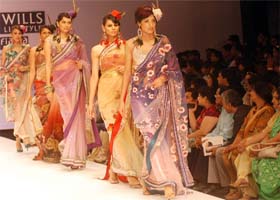 Models display creations by designer Rajdeep Ranawat on Wednesday, the last day of the Wills Lifestyle India Fashion Week Spring Summer 2012 collection at Pragati Maidan in New Delhi