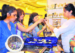 Women buy jewellery at an exhibition in Dehradun on Wednesday
