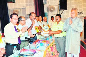 Progressive farmers are honoured during the inaugural ceremony of a farmers fair at GB Pant University in Nainital on Wednesday